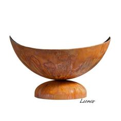 a wooden bowl sitting on top of a table