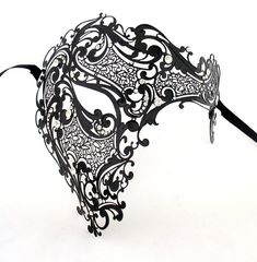 Made for men, can be worn on women as well. This deluxe, venetian-style decor mask features crystals, rhinestones and designs, will surely make you stand out stylishly. All of the masks are hand made and intricately designed offering each a unique flair. This Venetian mask comes in several colors. Elegant Black Theater Mask, Elegant Black Theater Masks, Masquerade Rhinestone Eye Mask, Masquerade Mask With Rhinestones For Carnival, Rhinestone Mask For Masquerade Carnival, Rhinestone Mask For Carnival Masquerade, Carnival Masquerade Mask With Rhinestones, Half Face Masquerade Mask, Masquerade Mask Men