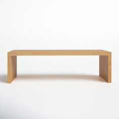 a wooden bench sitting on top of a white floor