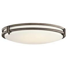 a flush light fixture with an oval glass shade