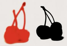 two silhouettes of cherries on a white background, one red and the other black