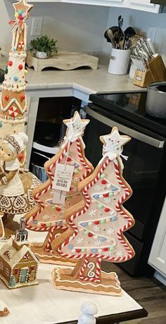 gingerbread christmas trees are on display in the kitchen