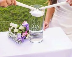 the bride and groom are getting ready to cut their wedding cake at the reception table