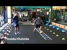 two men in a gym doing exercises on the treadmills with ladders and balls