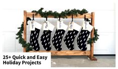 christmas stockings hanging from a wooden rack in front of a garage door with snow on the ground