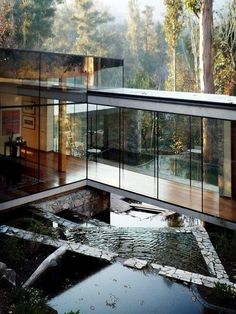 the inside of a house with glass walls