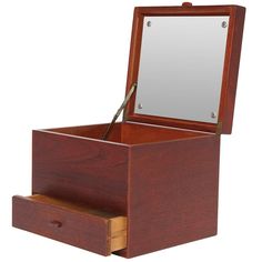 a wooden box with mirror and drawers