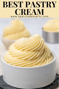 a white bowl filled with mashed potatoes on top of a table