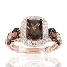 This delicious engagement ring features an elongated cushion-cut Brown cubic zirconia center stone, prong-set in a double-row pave white cubic zirconia halo. Crafted of rose gold over sterling silver, this ring features a combined pattern of white pave cubic zirconia and detailed metal work all across the band to create a royal-inspired design for the princess in you. With so much gorgeous detail put into every angle of this ring, this beautiful ring features a Brown pave criss-cross pattern, ce Brown Engagement Rings, Cushion Cut Engagement, Cubic Zirconia Engagement Rings, Brown Chocolate, Cushion Cut Engagement Ring, Cubic Zirconia Jewelry, Double Halo, Engagement Ring Sizes, Cubic Zirconia Rings