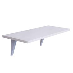 a white table sitting on top of a wooden shelf