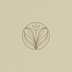 the logo for a flower shop is shown in brown and beige colors on a cream background