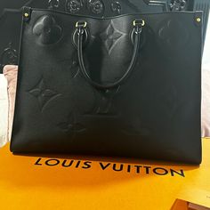 Almost New Beautiful Black Louis Vuitton Large Luxury Shopping Bag, Large Designer Bag With Detachable Handle, Designer Large Bag With Detachable Handle, Designer Large Bags With Detachable Handle, Luxury Large Bags With Detachable Handle, Large Luxury Bags With Removable Pouch, Luxury Large Bag With Detachable Handle, Luxury Large Shoulder Bag With Top Carry Handle, Luxury Large Shoulder Bag With Removable Pouch