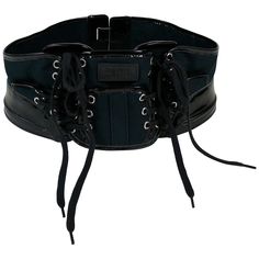 JEAN PAUL GAULTIER collector boxing corset belt. This belt features : - Dark navy blue canvas panels embellished with black patent PVC details. - Black laces on front. - Silver toned eyelets. - Rubber JEAN PAUL GAULTIER patch on the frontal panel. - Velcro fastening on the back. Indicated sizes : US 12 / UK 14 / FR 80. Made in France. Indicative measurements : adjustable length from approx. 78 cm (30.71 inches) to approx. 79 cm (31.10 inches) / max. width approx. 12 cm (4.72 inches). BELT CONDIT Black Leather Gothic Corset Belt, Black Leather Corset Belt With Belt Loops, Black Gothic Corset Belt With Belt Loops, Punk Style Black Corset Belt With Included Belt, Black Leather Corset Belt With Belt Detail, Luxury Black Corset Belt With Belt Loops, Black Luxury Corset Belt With Belt Included, Luxury Black Corset Belt With Belt Included, Black Punk Corset Belt With Belt Loops