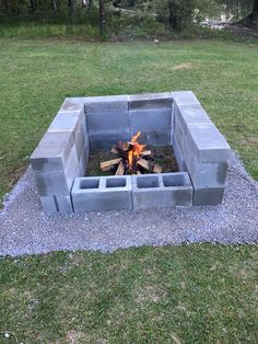 an outdoor fire pit made out of cinder blocks