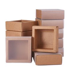 several cardboard boxes stacked on top of each other with one empty box in the middle