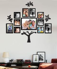 a family tree with many pictures hanging on it's wall in a living room