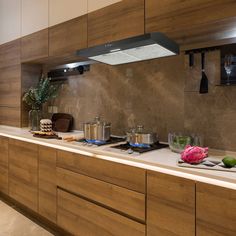 a kitchen counter with pots and pans on top of it next to a stove