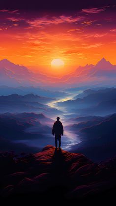 a man standing on top of a mountain under a sunset