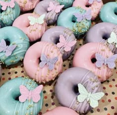 there are many doughnuts that have been decorated with different colors and designs on them