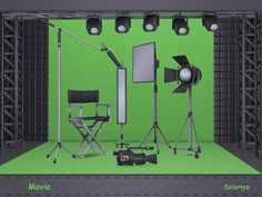 an image of a green screen studio setting with lights and camera set up on the floor