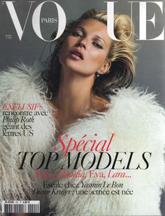 a woman in white fur coat on the cover of a magazine