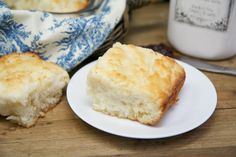 a piece of biscuit sitting on top of a white plate