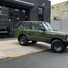 an suv parked in front of a building