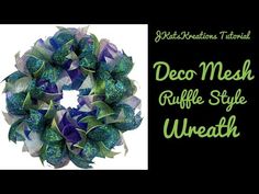 a green and blue wreath with the words deco mesh ruffle style wreath