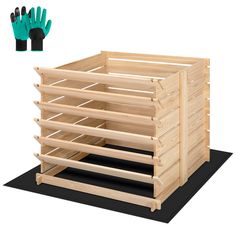 a wooden box with five pairs of gardening gloves in front of it and two green gloves next to it