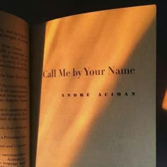 an open book with the title call me by your name written on it's cover