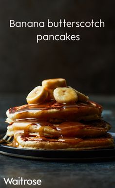 a stack of banana butterscotch pancakes on a black plate