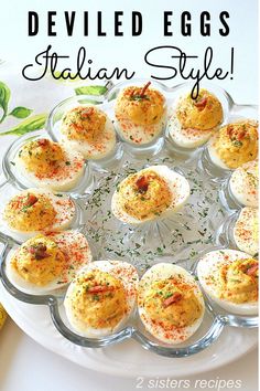 deviled eggs with italian style toppings on a plate