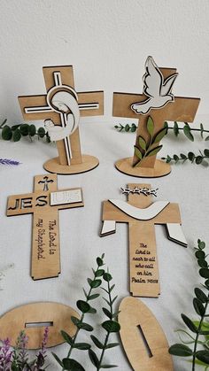 wooden crosses and flowers on a table