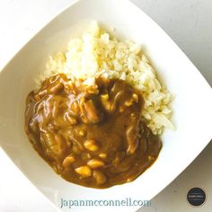 a white bowl filled with rice and beans