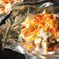 some food is laying on foil and ready to be eaten in the oven for dinner