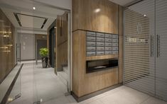 an office lobby with wooden paneling and metal mailboxes on the wall, along with glass doors