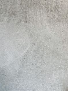 a man riding a skateboard up the side of a cement wall