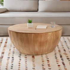 a wooden table sitting on top of a white rug