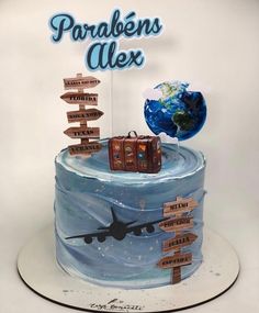 there is a cake made to look like an airplane with wooden signs on the side