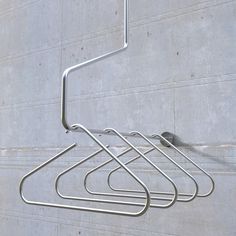 three metal racks on the side of a building