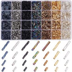 the assortment of different colors and sizes of screws in plastic storage bins on a white background