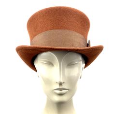 Brown top hat. You can make the hat with your favorite color by choosing it from my Wool felt color card. In the ad, this is the chocolate color Made with chocolate brown wool felt short crown and embellished with a grosgrain ribbon. Edwardian top hat ideal for everyday and special ocasions such as weddings, cocktails or parties. For man and woman. Measurements in centimeters are 32 x 27. Crown height 11. Brim length 6. These measurements may have some slight variation depending on the size of t Formal Brown Fur Felt Hat Band, Classic Formal Mini Hats With Wide Brim, Formal Brown Brimmed Top Hat, Classic Wide Brim Mini Hat For Formal Occasions, Elegant Brown Top Hat For Winter, Classic Brown Felt Hat With High Crown, Classic Formal Fur Felt Cloche Hat, Brown Fur Felt Top Hat For Formal Occasions, Classic Brown Hat Bands For Kentucky Derby