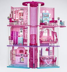 a doll house with all the furniture and accessories in it's pink color scheme