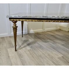 Superb Quality French Ormolu and Marble Coffee Table  This is a a very unusual piece the base is made in brass ormolu with intricate chased decoration  The top is a beautifully figured Italian slab of marble and has a chased brass apron below  A very good looking piece it is sound and sturdy the table is 18” high, 48” long and 24” wide Marble Coffee Table, A A, The Table, Apron, Marble, Coffee Table, Sound, Brass, Coffee