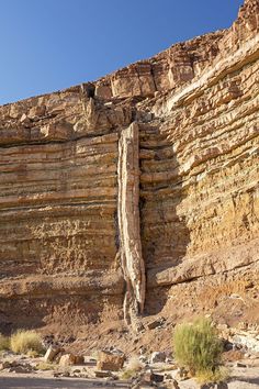 a large rock formation in the middle of a desert