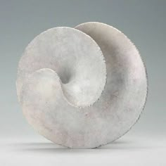 two white circular objects sitting on top of each other