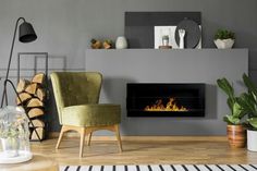 a living room with a fire place and potted plants