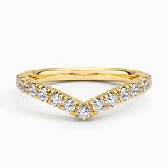 a yellow gold band with diamonds on it