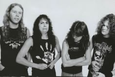 three women standing next to each other with their arms crossed