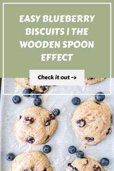 blueberry biscuits on a baking sheet with text overlay that reads easy blueberry biscuits the wooden spoon effect check it out